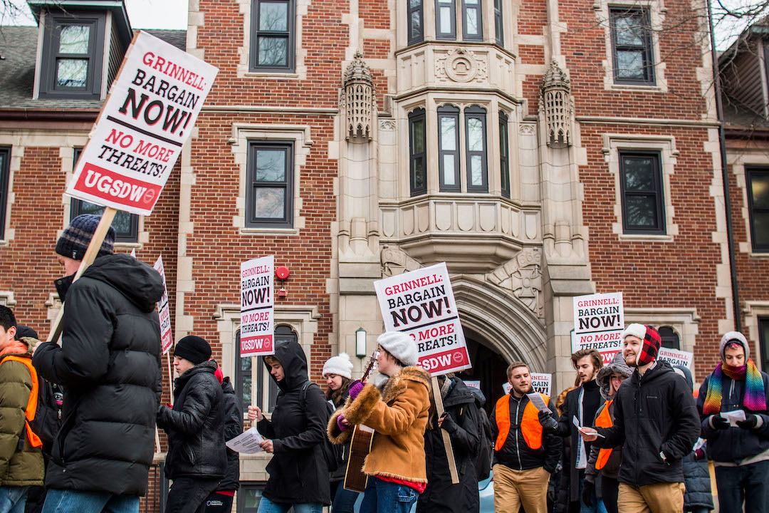 UGSDW members march to protest Grinnell's actions
